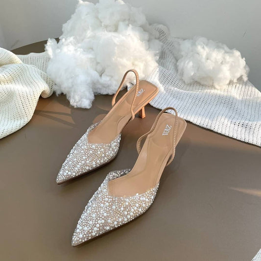 High-heel slingback shoes with faux pearls on the front